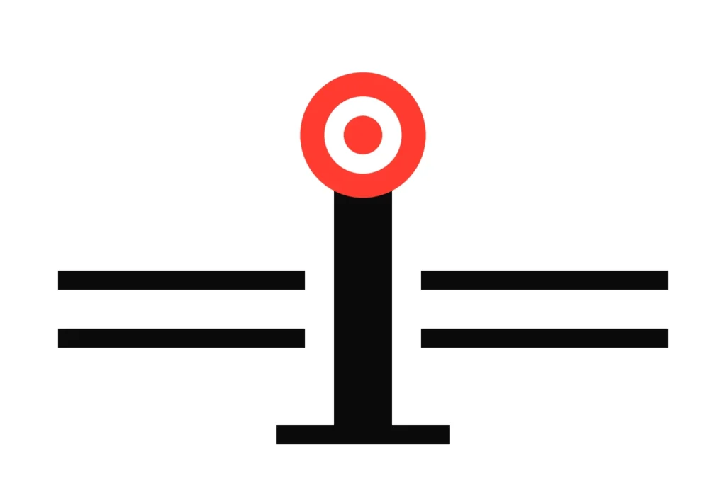 A racecourse winning post with a red and white roundel beside the running rails, where settlement starts